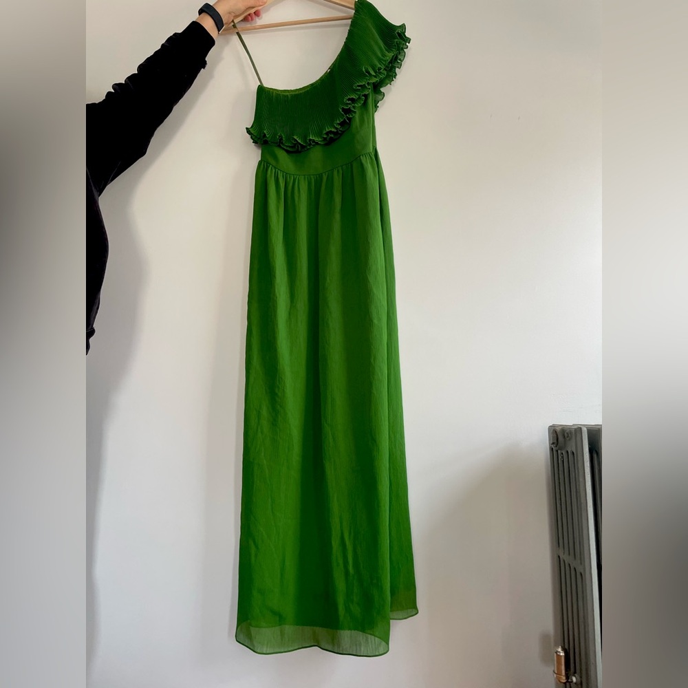 Beautiful emerald-green one-shoulder evening gown.